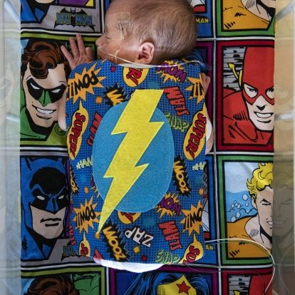 baby in superhero gear