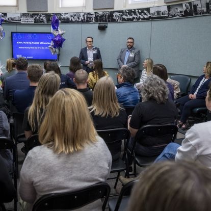 executives presenting at awards ceremony