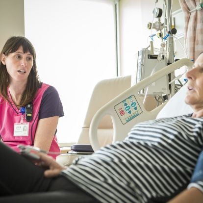 Apheresis lead nurse Julie Williams A KHSC nurse speaking with a patient