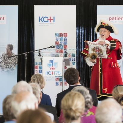 Kingston Town Crier Chris Whyman helps spread the news about KGH's anniversary.