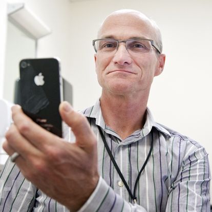 Dr. Graeme Smith in his clinic at KGH using one of his apps.