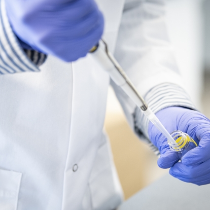 Researchers work in a lab at KHSC