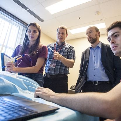 Dr. Zoltan Tataks, inventor of the iKnife receives a demo of the visual mapping technology from the Perk Lab team
