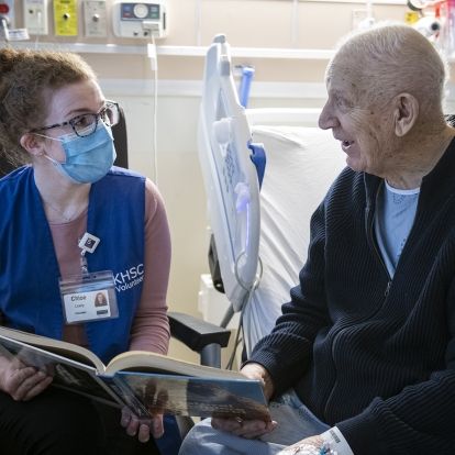 A volunteer visits a patient at KHSC