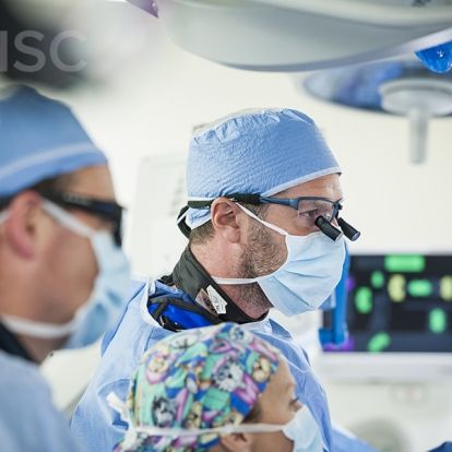 Cardiac surgeon, Dr. Gianluigi Bisleri (R) works along side cardiologist, Dr. Ben Glover (L) during the procedure at KHSC.
