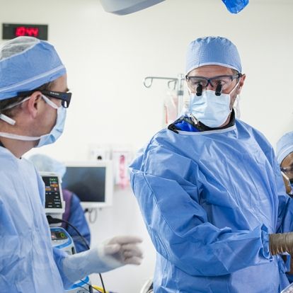 Cardiac surgeon, Dr. Gianluigi Bisleri (R) works along side cardiologist, Dr. Ben Glover (L) during the procedure at KHSC.