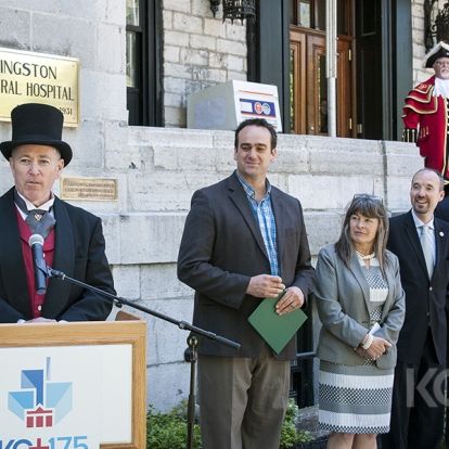 Emcee, Interim CEO Jim Flett, dressed in period attire welcomes dignitaries representing all three levels of government