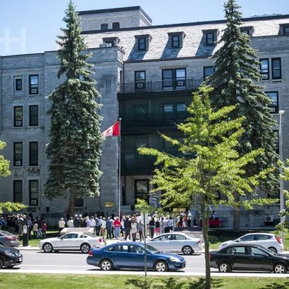 A large crowd gathers outside of the Watkins wing to celebrate the 175 anniversary of the first Parliament meeting at KGH