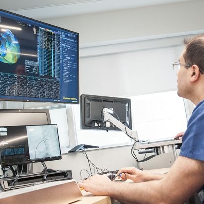 An international physician learning how to use the cardiac mapping system in place at KHSC