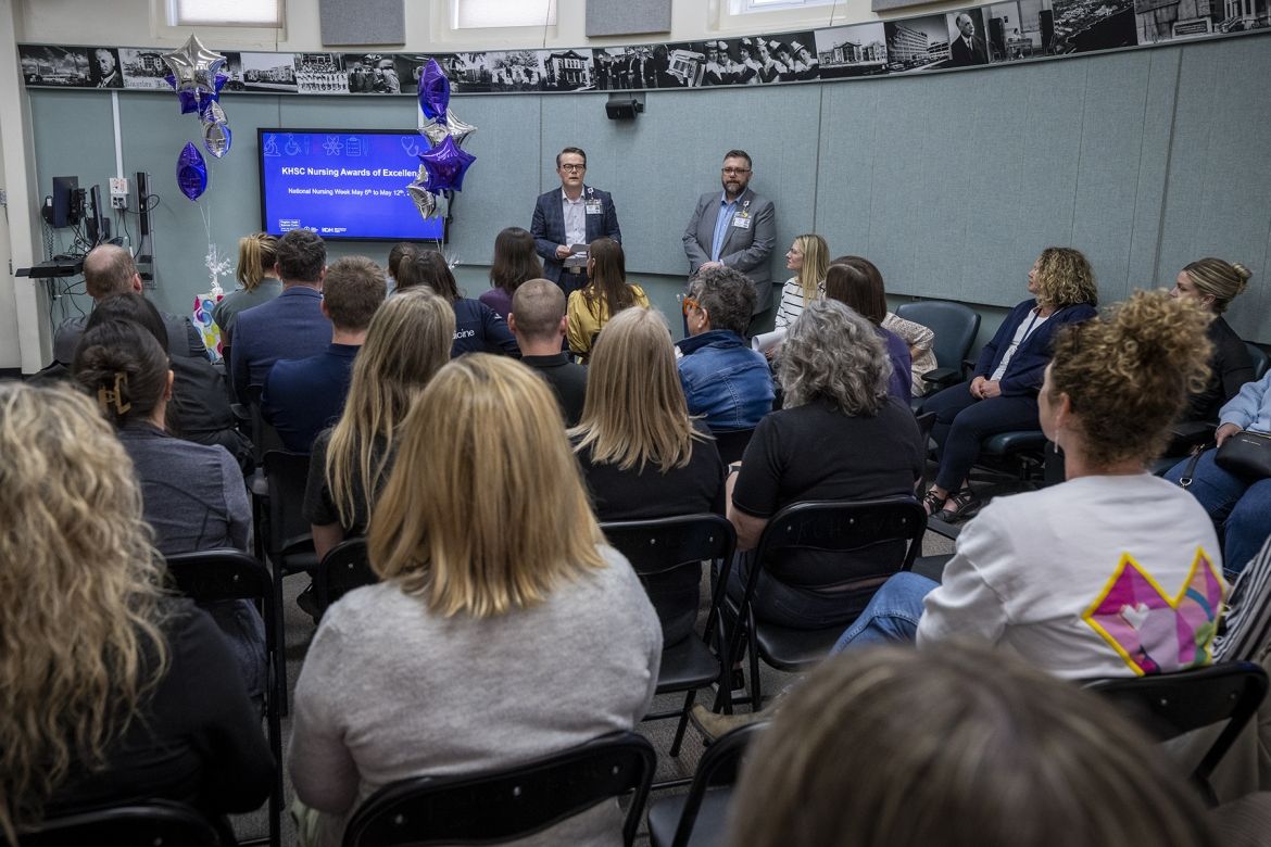 executives presenting at awards ceremony