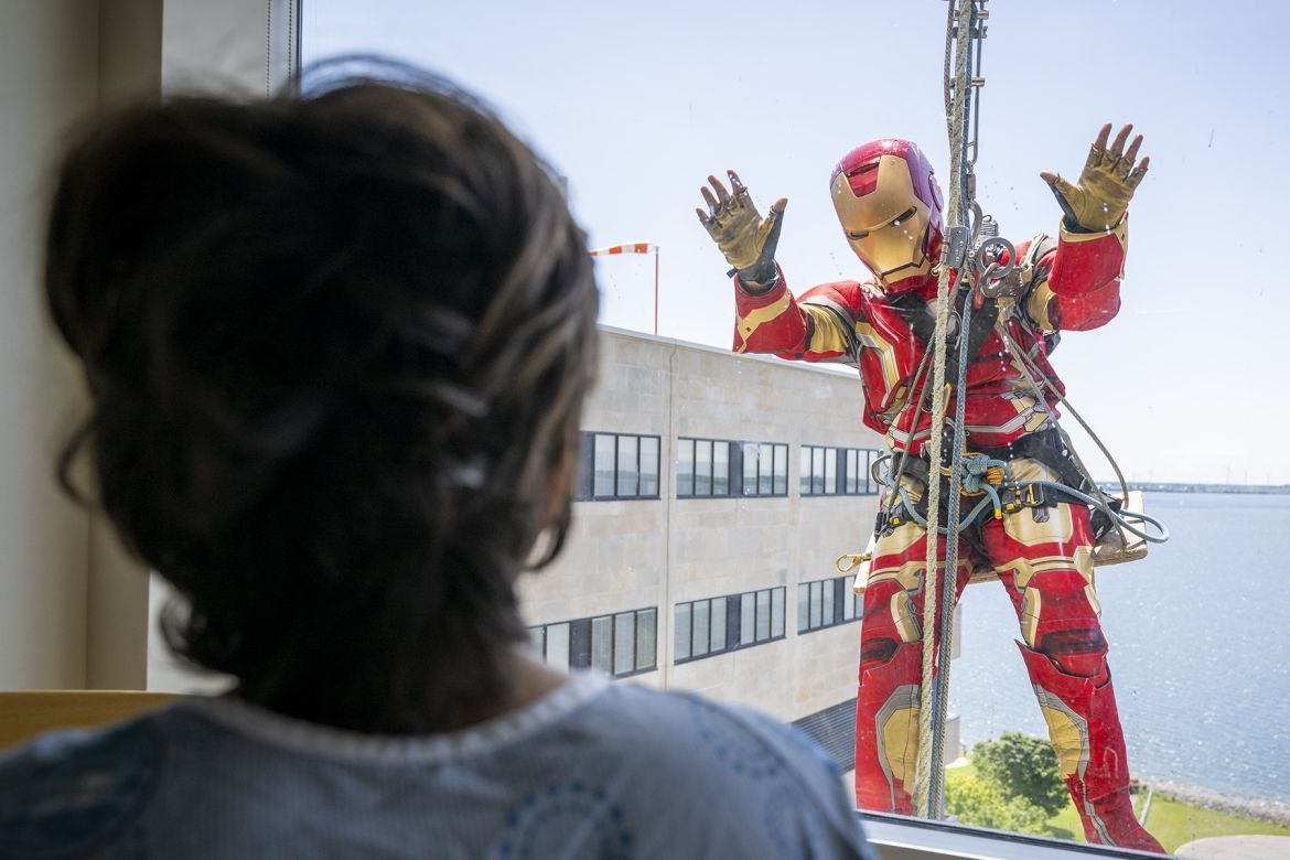 iron man waves at a patient at KHSC