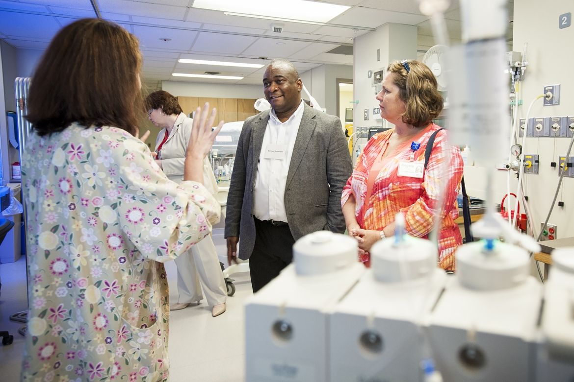 Bernard Roberson from Georgia Regents Health and Angela Morin, KGH Patient Experience Advisor, talk with staff in our newly renovated Neonatal Intensive Care Unit about the new Family Integrated Care model they are helping pioneer.