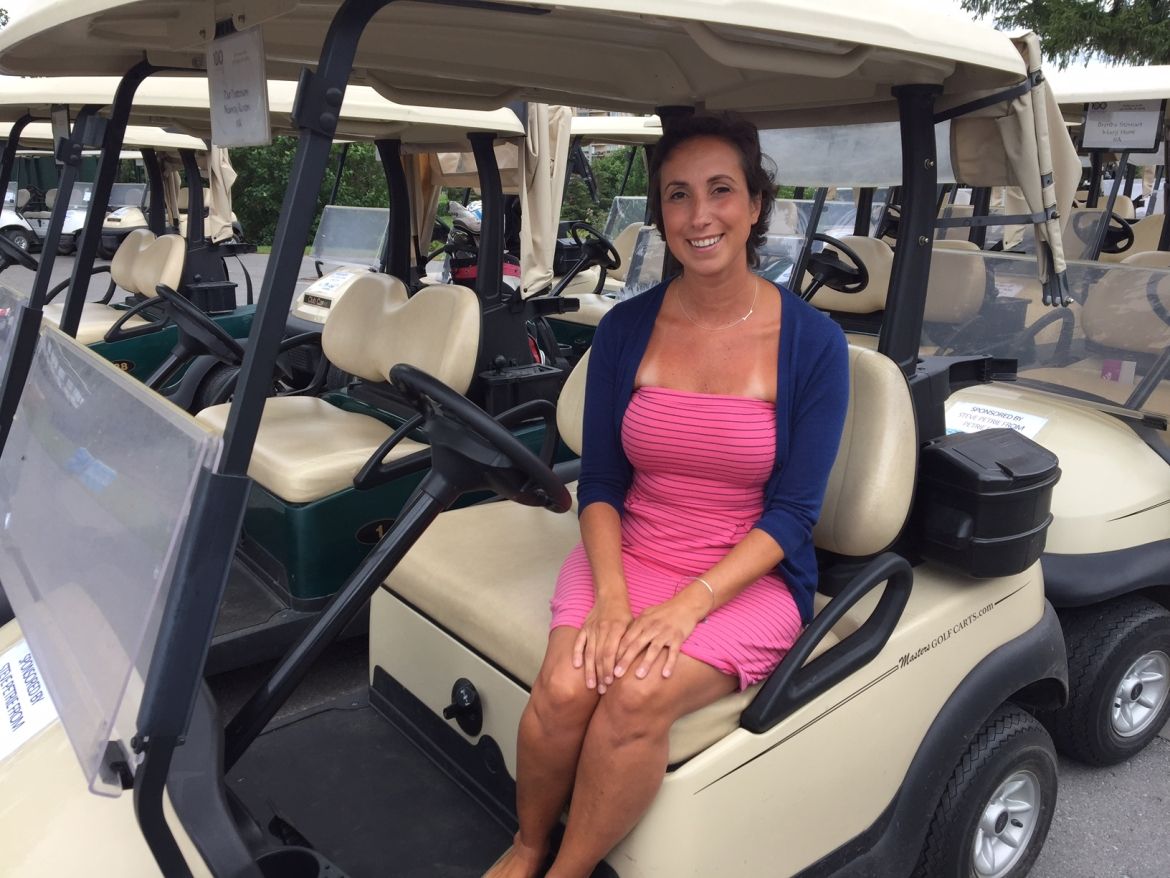 Breast cancer survivor Liz Adamson spoke to the golfers about her experience and how their support impacted her life