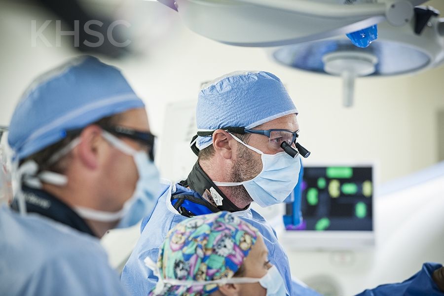 Cardiac surgeon, Dr. Gianluigi Bisleri (R) works along side cardiologist, Dr. Ben Glover (L) during the procedure at KHSC.