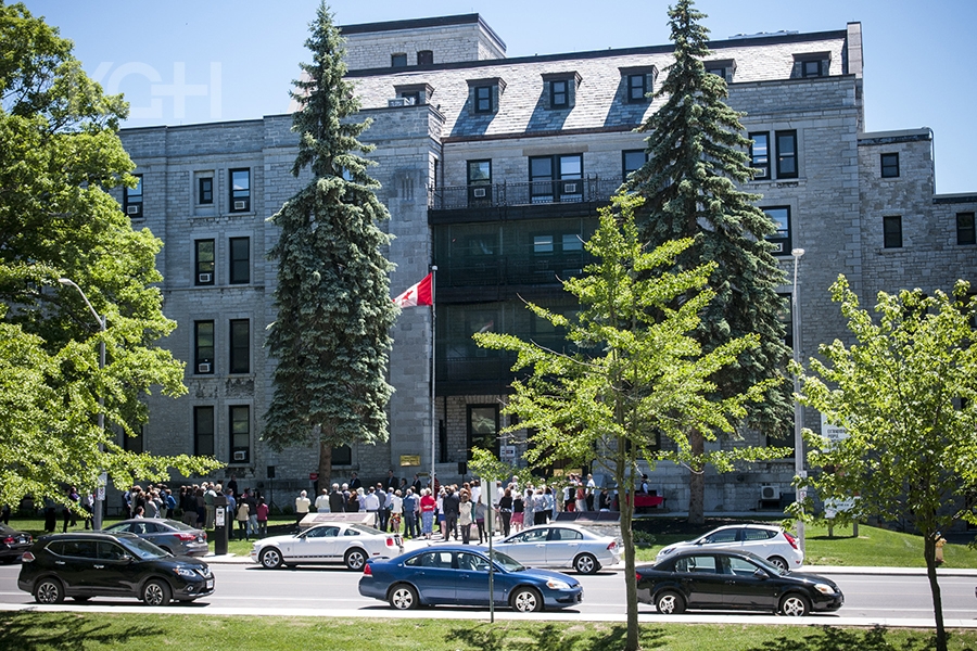 A large crowd gathers outside of the Watkins wing to celebrate the 175 anniversary of the first Parliament meeting at KGH
