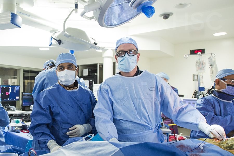 Cardiologist, Dr. Ben Glover (R) works at the patients' side during this hybrid ablation procedure at KHSC.