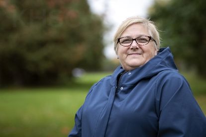 woman in blue raincoat