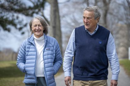 Maureen and Graham Rush walking in a park