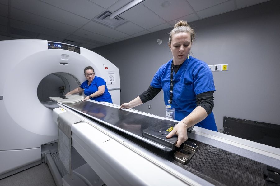 Staff prepare KHSC's new PET-CT scanner for use