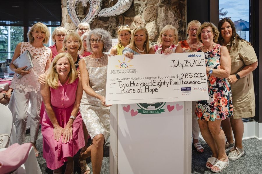 Event organizers cheque presentation for Rose of Hope