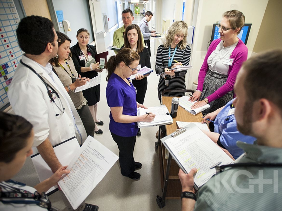 Interdisiplinary team members get together to round beofre visiting patients on their unit.
