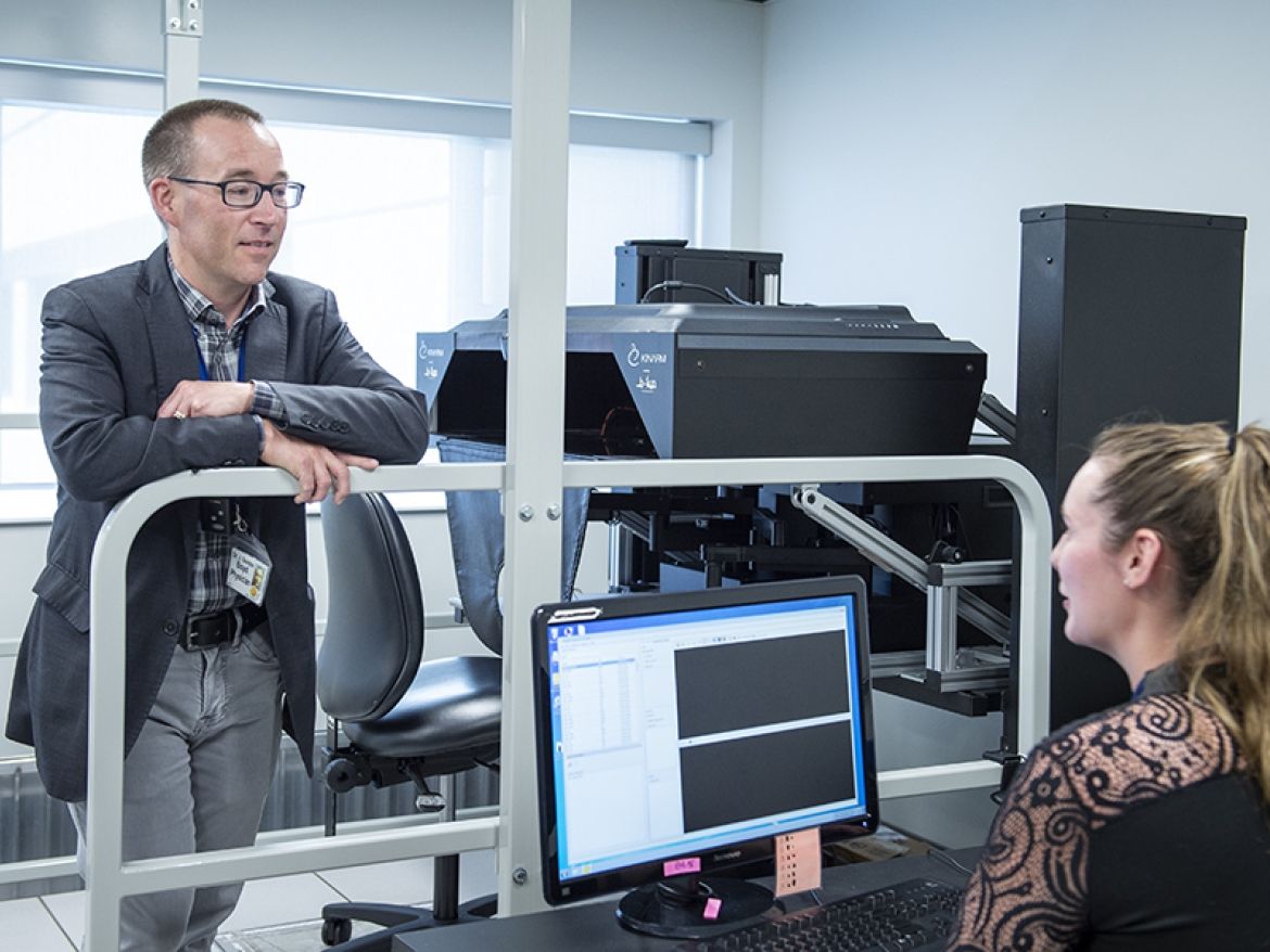 Dr. Gord Boyd and PhD candidate Jessica Vanderlinden with the KINARM in the W.J. Henderson Centre for Patient Oriented Research