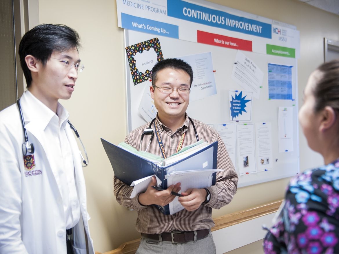 Staff on a unit talking together about the quality road map