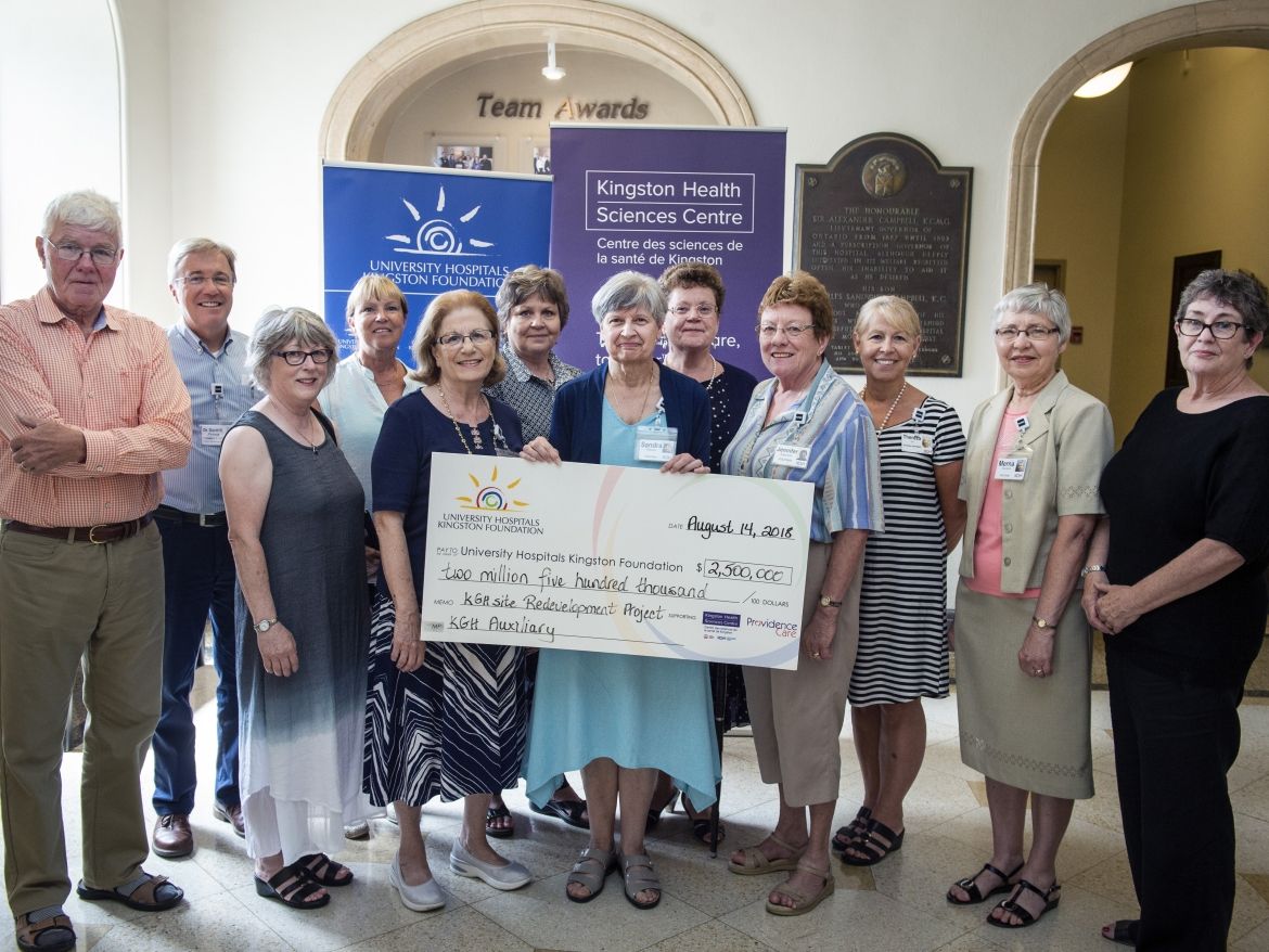 Members of the KGH Auxiliary present a cheque to representatives of the University Hospital's Kingston Foundation as well as the KHSC Board of Directors and Executive team.