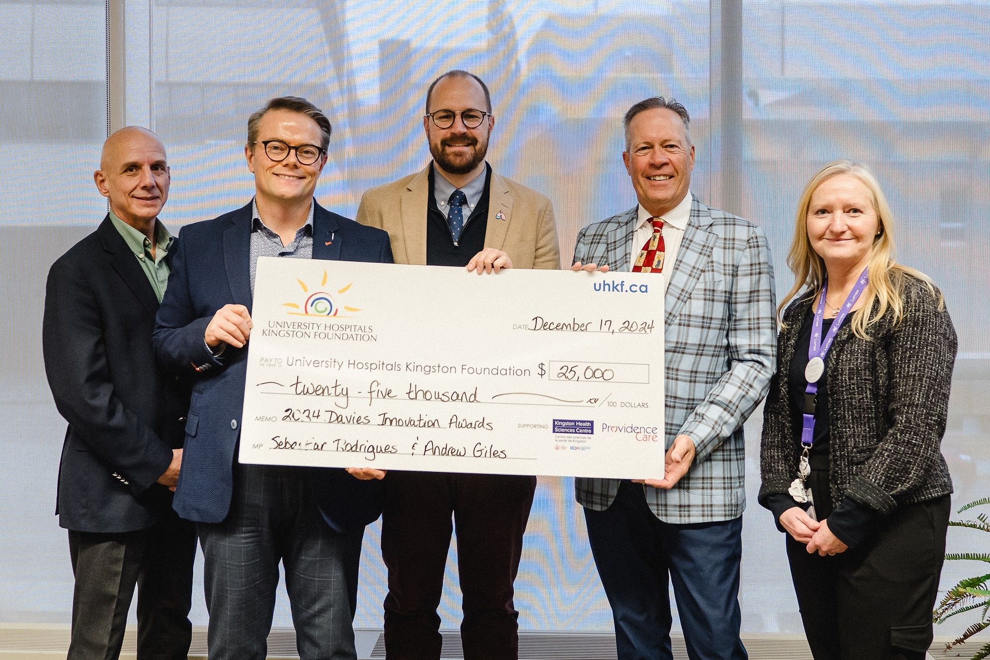 Cheque presentation with Tom Zsolnay, Jason Hann, Sebastian Rodríguez-Llamazares, Greg Davies, and Darcy Woods-Fournier