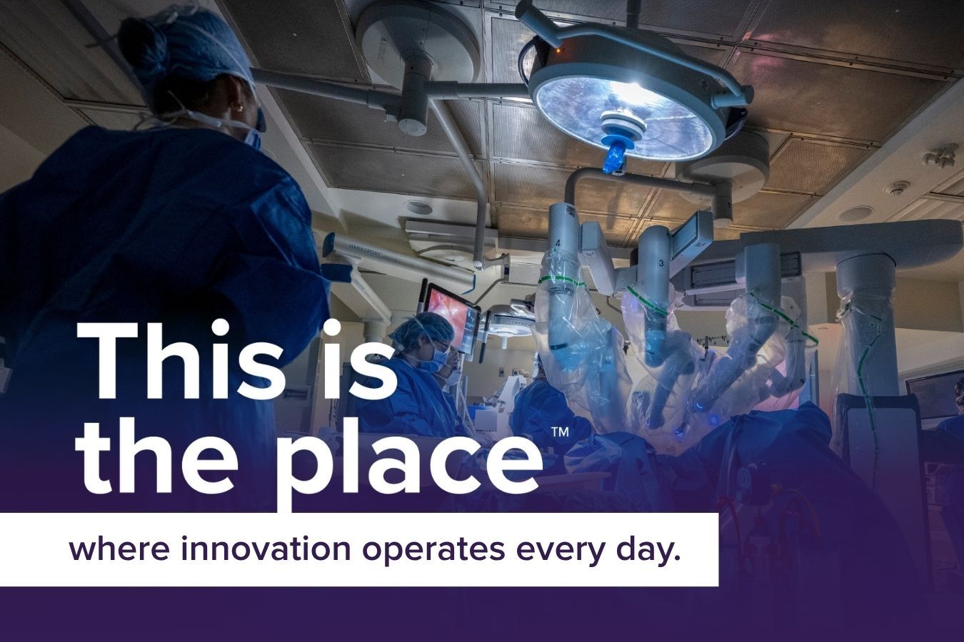 an operating room with a surgical robot at KHSC. Text overlay says " this is the place where innovation operates every day.