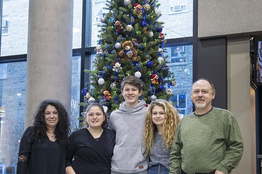 "We’re hoping that by just seeing the tree or maybe sitting nearby briefly, people will feel their worries ease, even for a few minutes, ” says Don McCullough (far right), posing here with his family (from left): Laura, Gabby, Luca and Lilly.