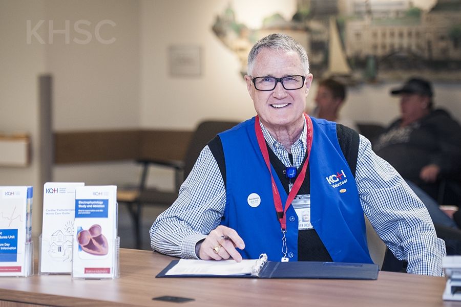 Volunteer Don Cooper greets patients from his post every Wednesday at the Cardiac Care Information Desk at KGH