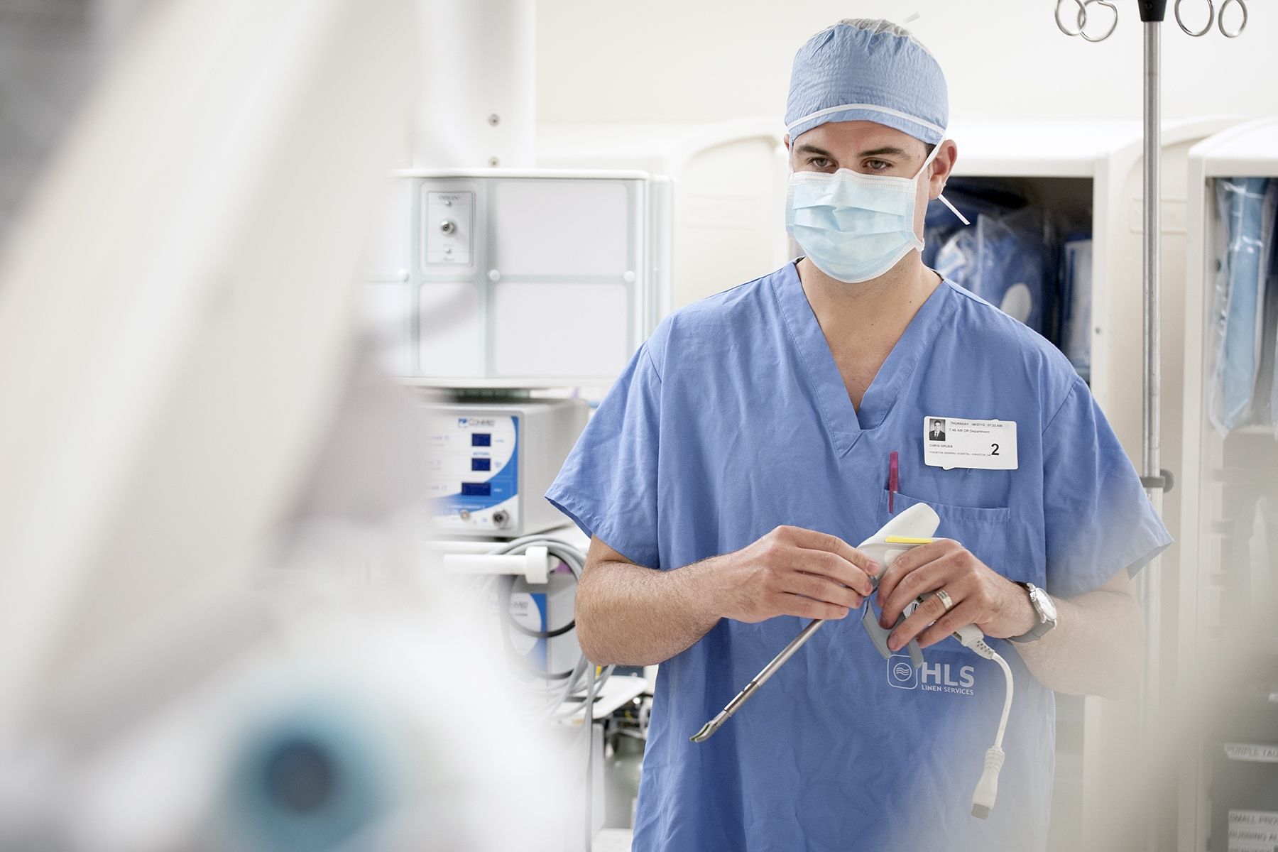 A surcial equipment supplier standing in the OR