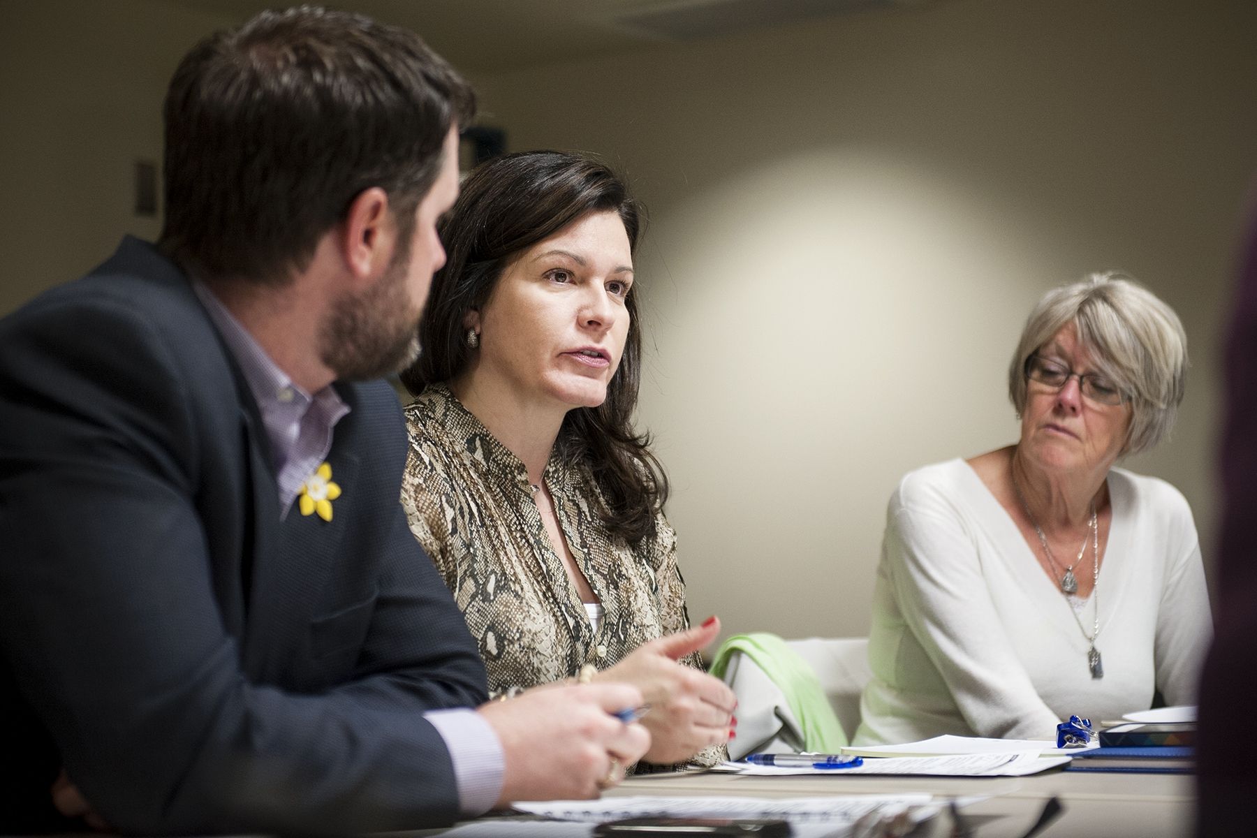 KGH Patient Experience Advisors Marla Rosen and Barb Girard speak with staff at a program council meeting.