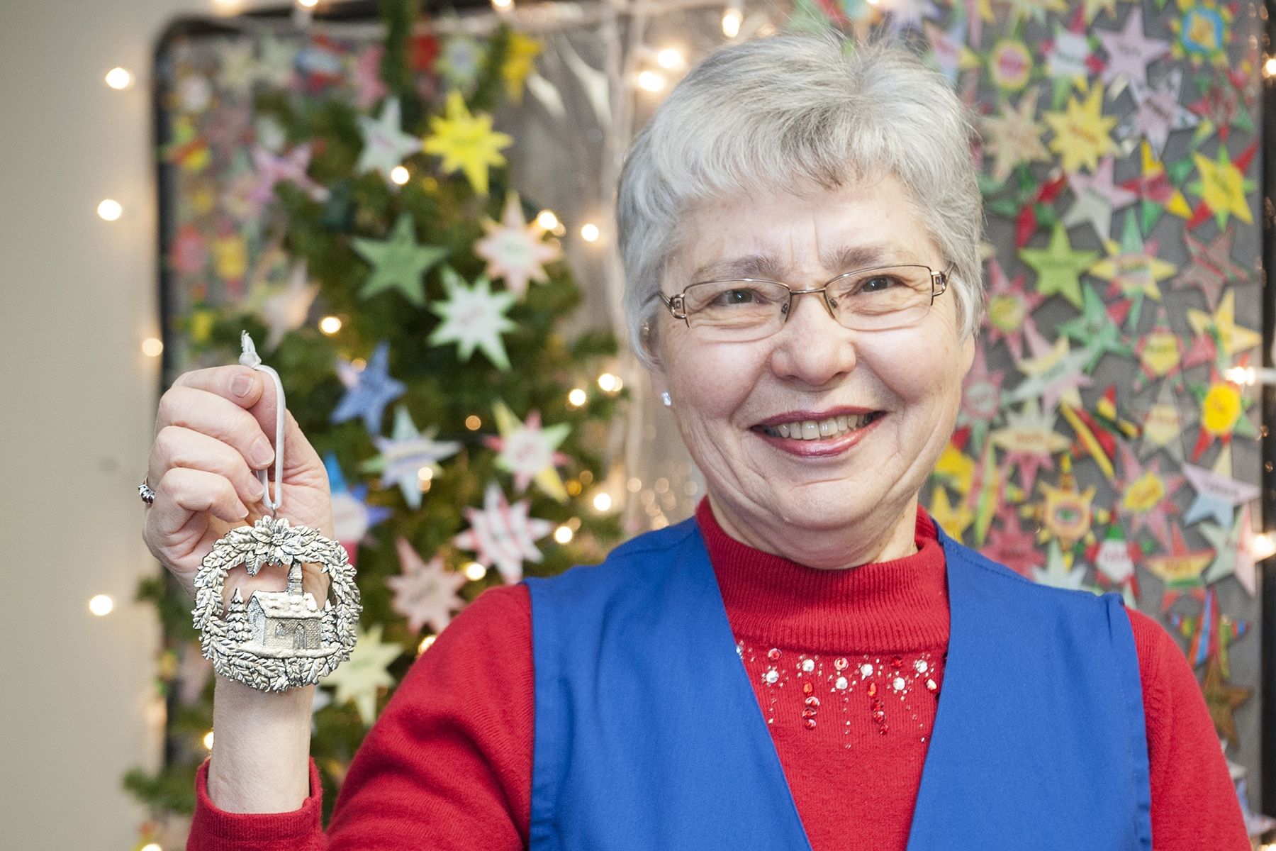 Merna Manders, co-convenor of the Auxiliary's Patient Comforts Committee, shows off the ornament that will be given out to patients this Christmas Eve.