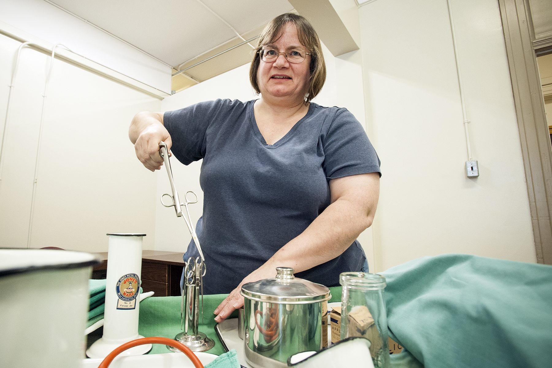 Museum of Health Care Collections Manager Kathy Karkut puts together the ‘Artefact Roadshow’ booth that will be run by members of the KGH Nurses Alumnea Association.