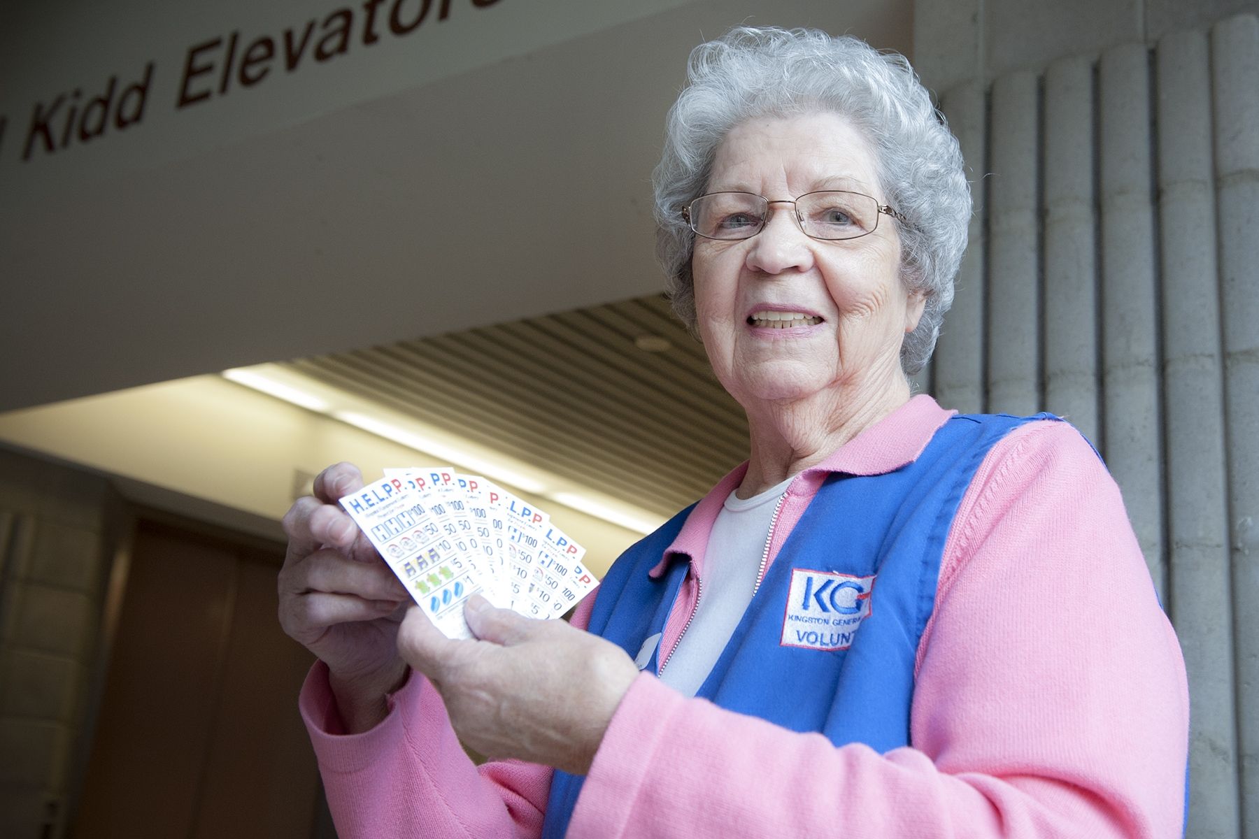 Auxiliary member Alice Roberston sells HELPP lottery tickets.