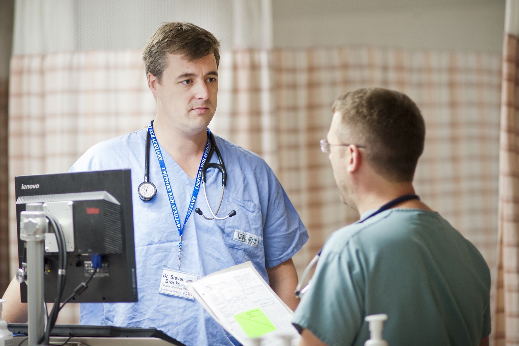 Dr. Steven Brooks talking to a colleague in the Emergency Department at KGH.