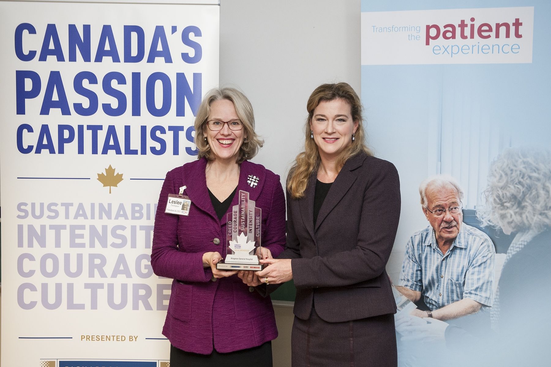 KGH President & CEO Leslee Thompson receives KGH's Passion Capital Award from Leslie Carter, Chief Brand & Strategy Officer at Knightsbridge Human Capital Solutions on December 1, 2014.