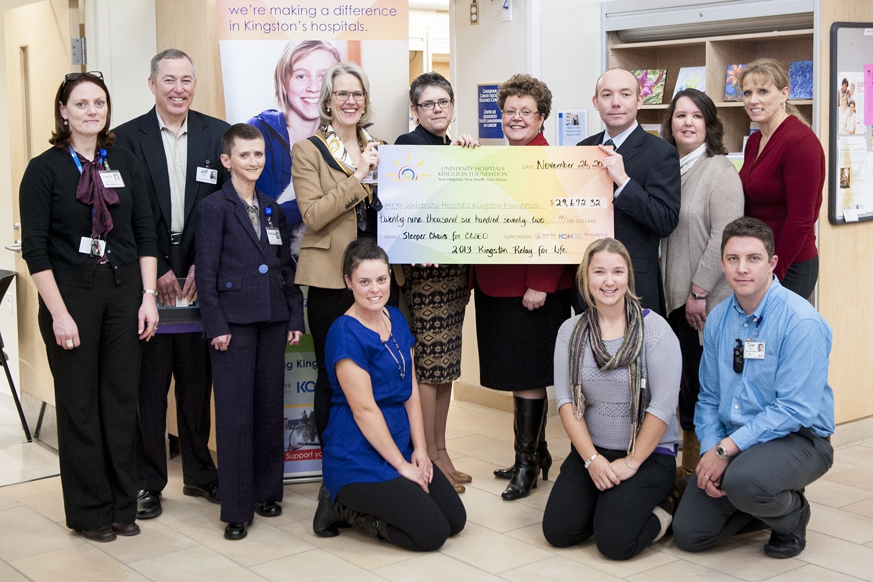KGH staff standing for group photo around large cheque of $29,672.32 for Relay for Life