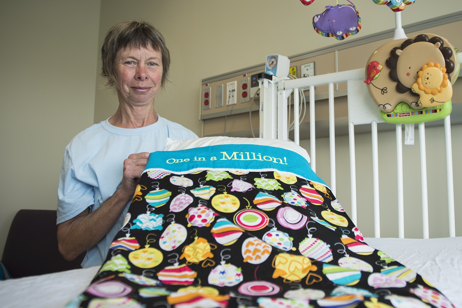 Liz Withers from Ryan's Case for Smiles celebrates the donation of the charity's one millionth pillowcase at KGH