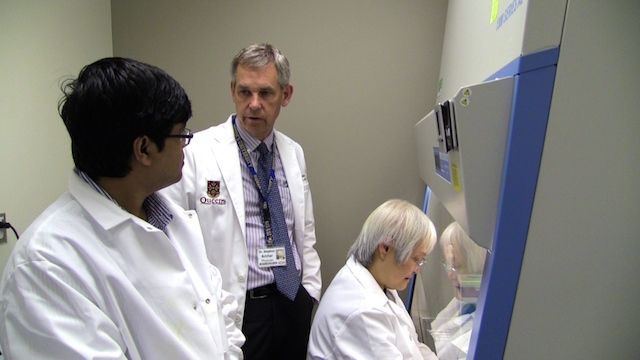 Dr. Archer with his colleagues in the lab