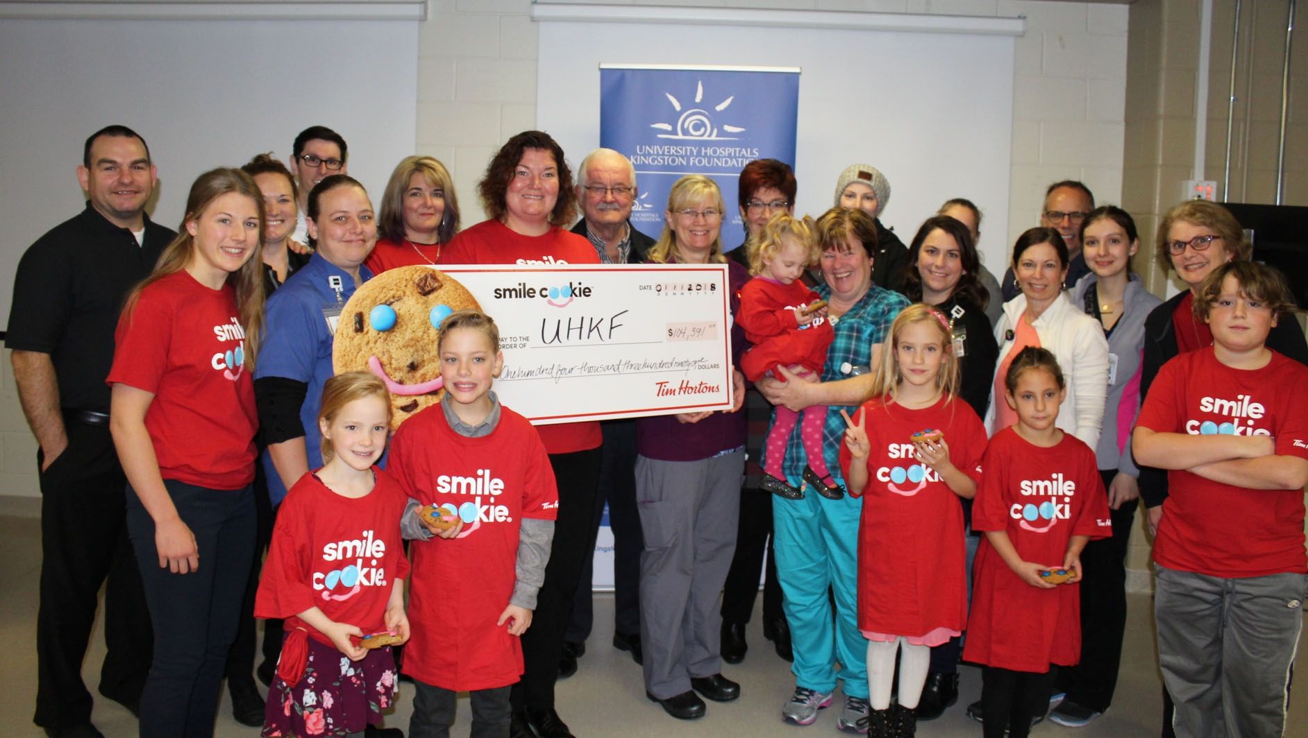 Representatives from local Tim Hortons present the proceeds of the campaign to KHSC and UHKF staff, patients and families