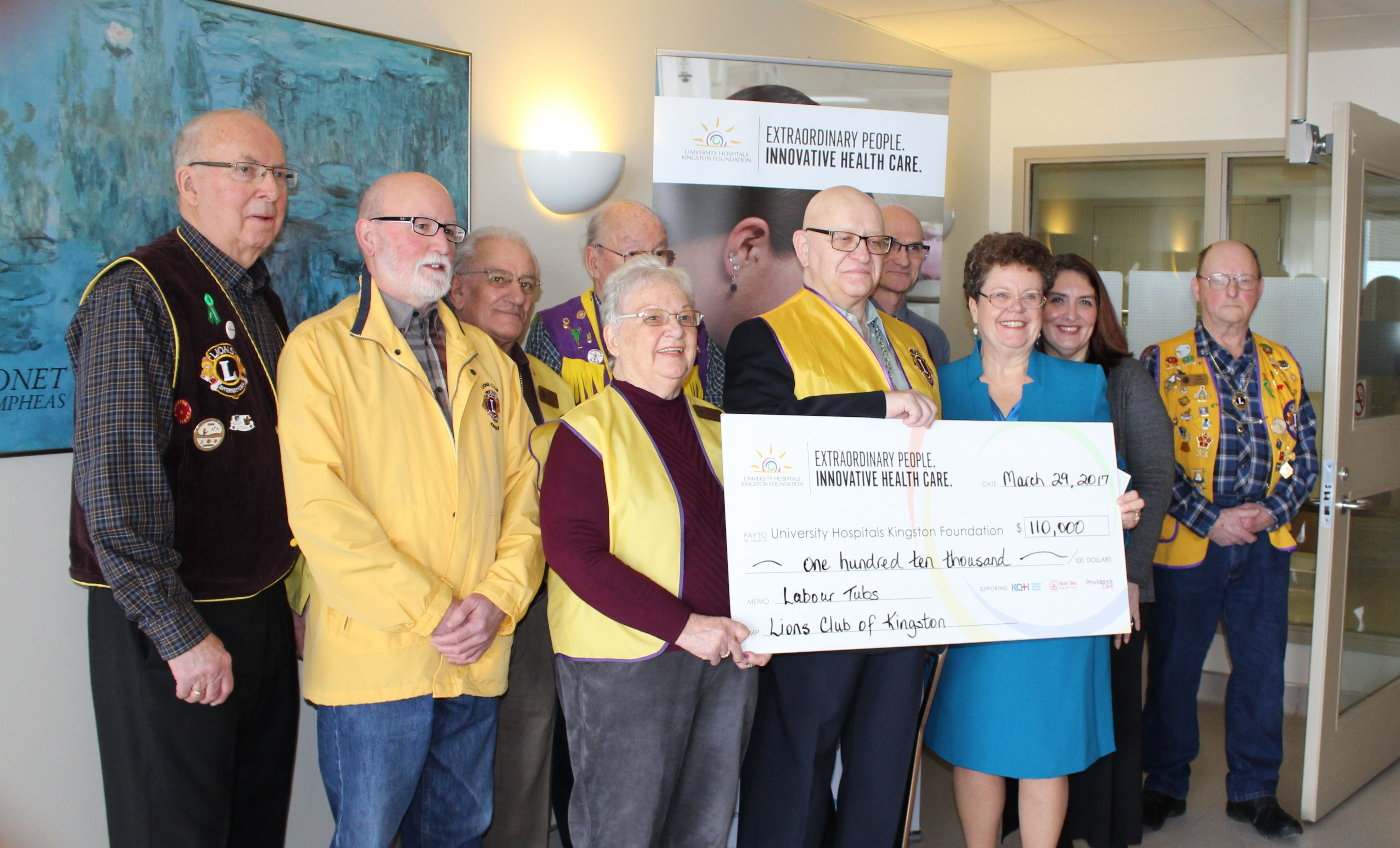 Members of the Lions Club present UHKF President & CEO Denise Cumming with their $110,000 donation to KHSC