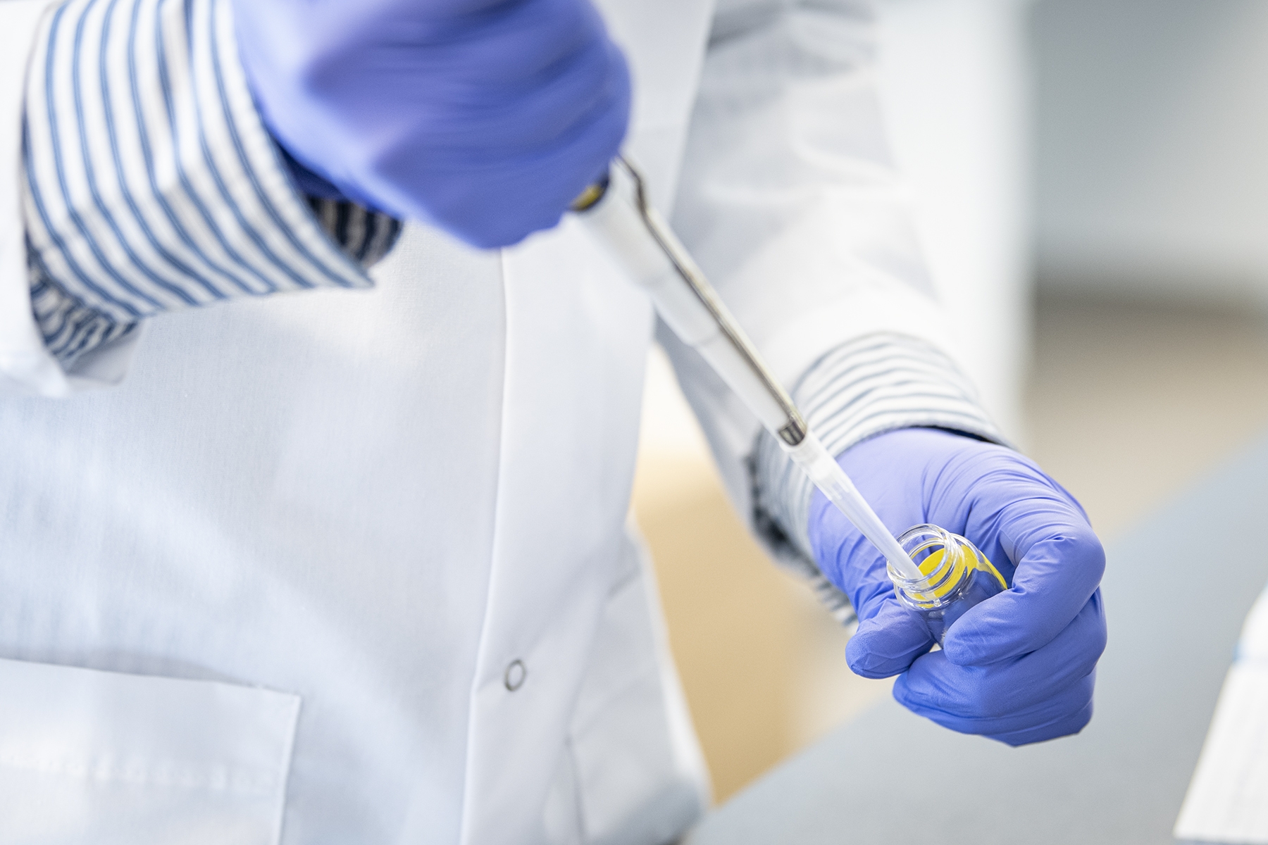 Researchers work in a lab at KHSC