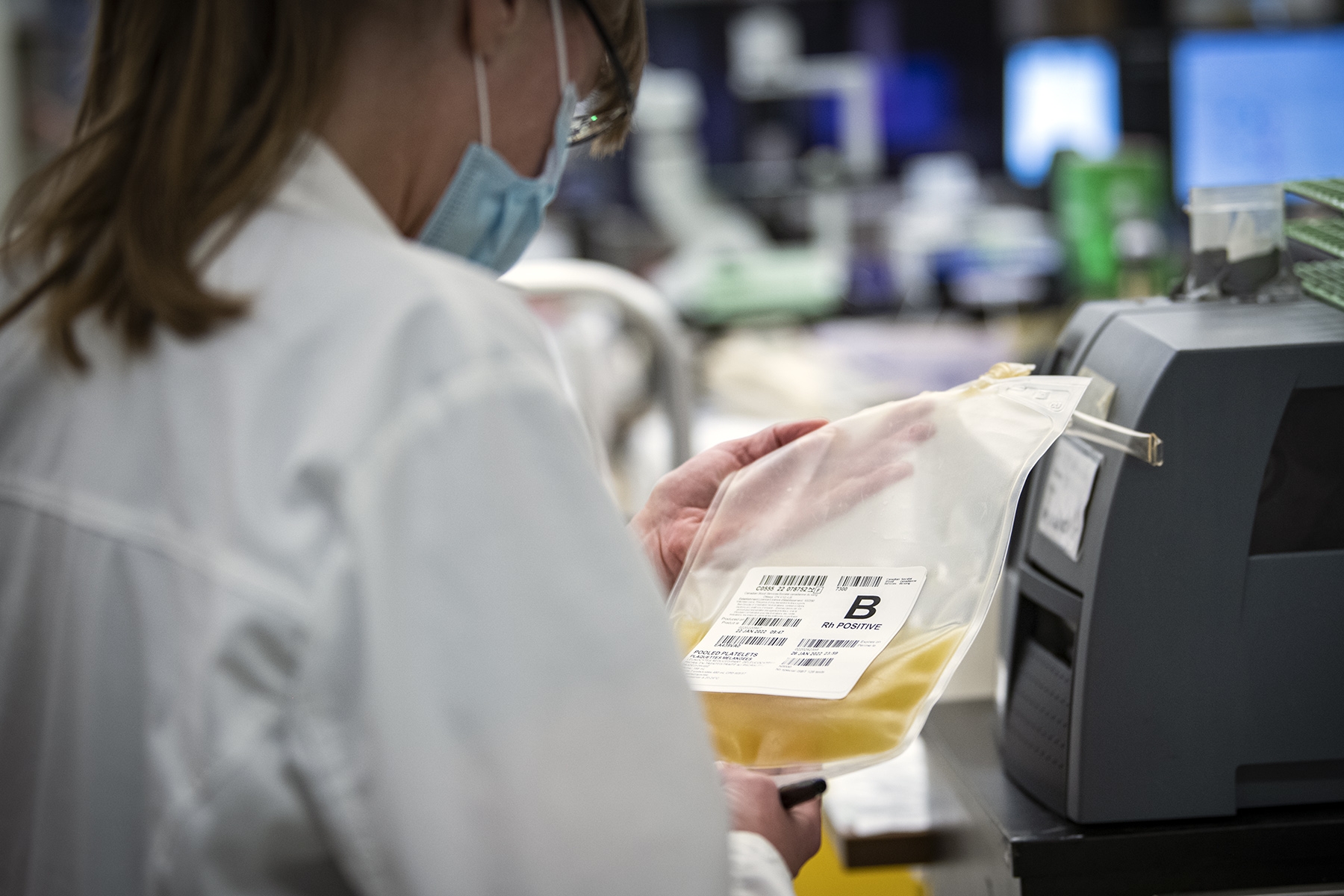 Lab techs unload a shipment of the new platelet product