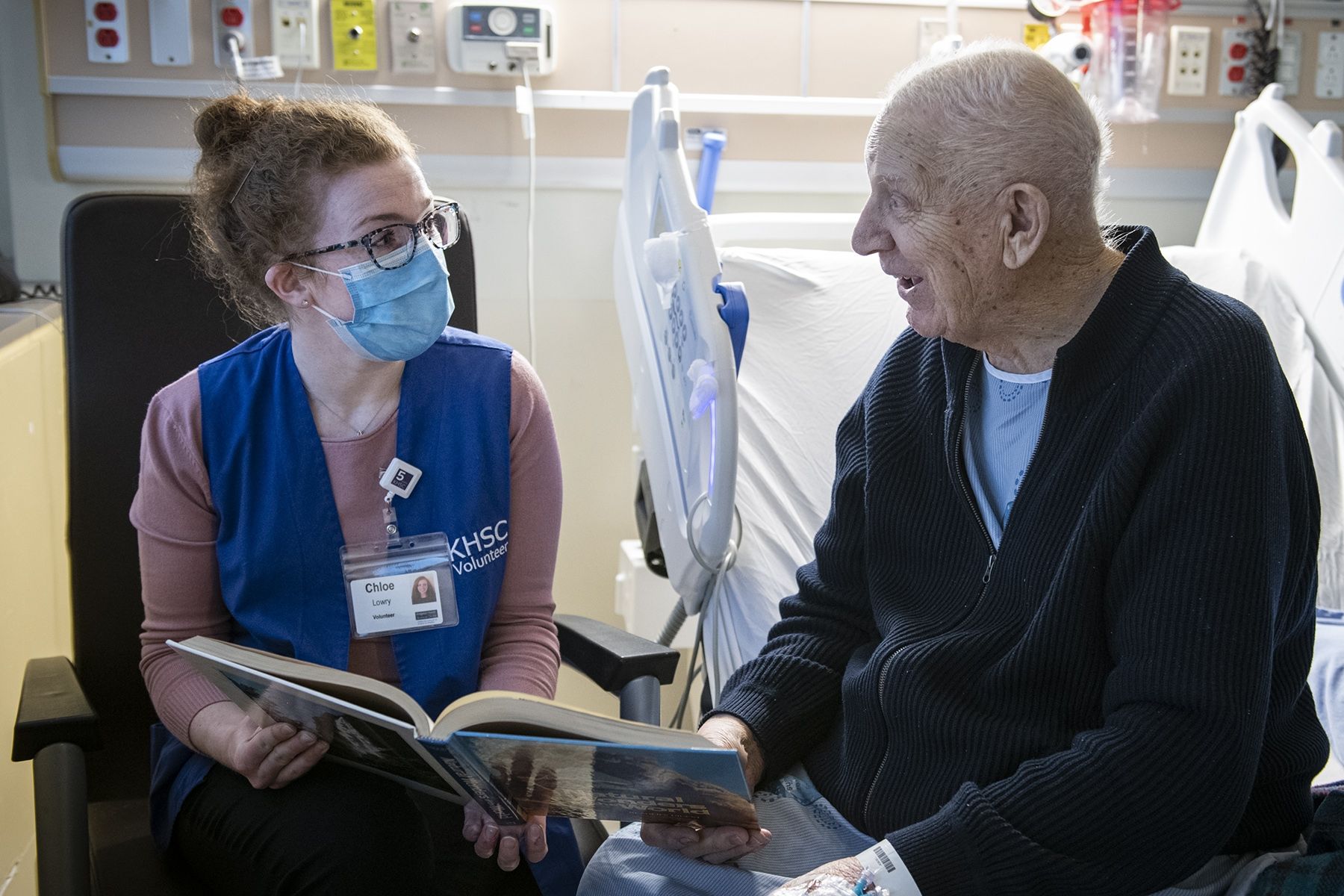 A volunteer visits a patient at KHSC