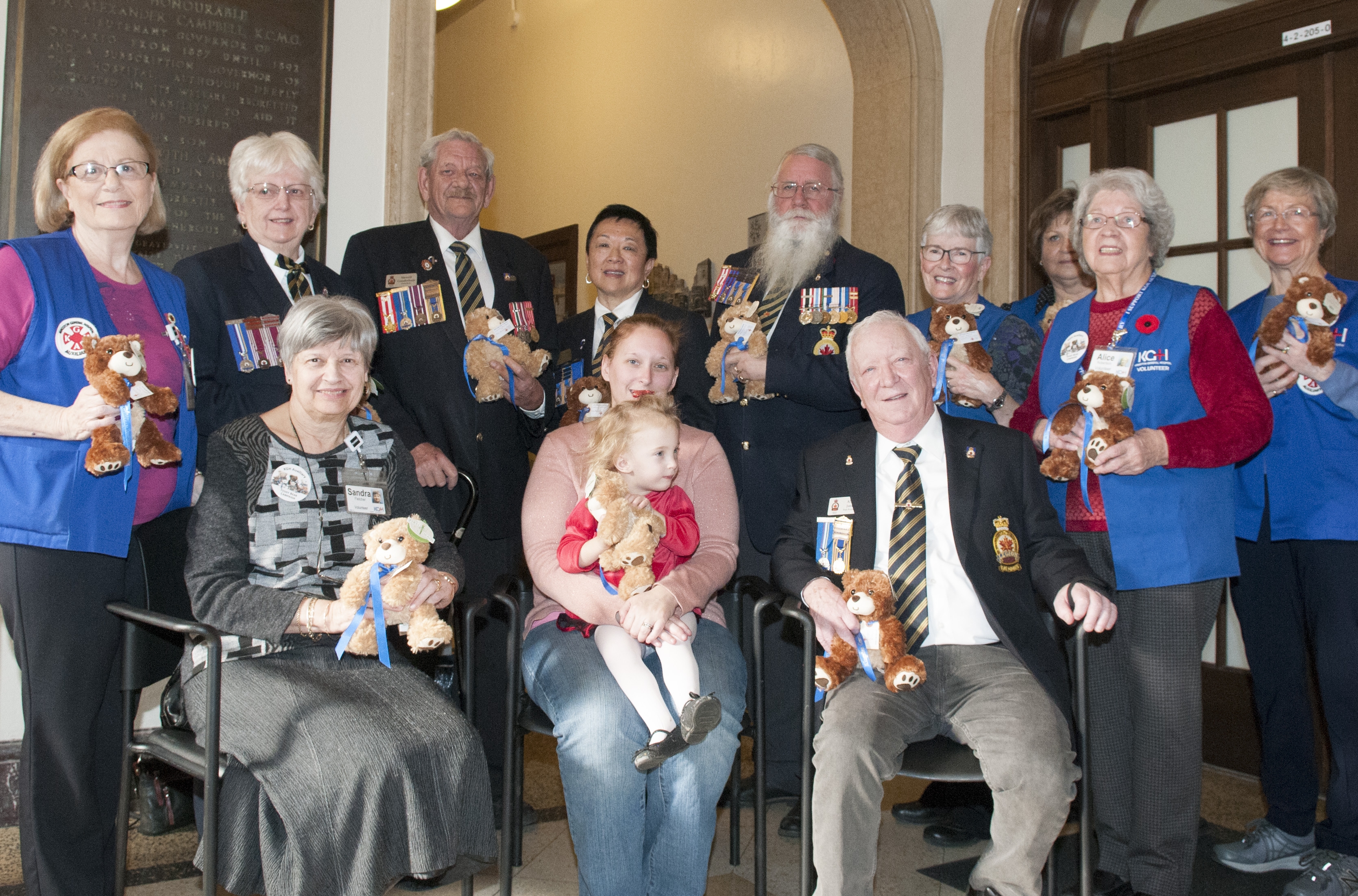 Members of the KGH Auxiliary and the Royal Canadian Legion, help Spencer and her mother Jessica launch the 2018 campaign