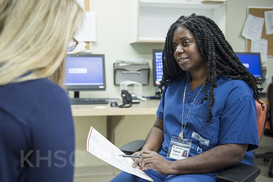 Dr. Julie Franis consults with a patient for a Pap Party clinic