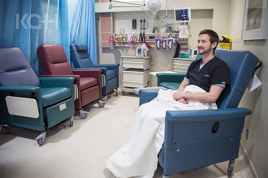Drew Henson, Registered Nurse, demonstrating how the new lounge chairs work in the ED.